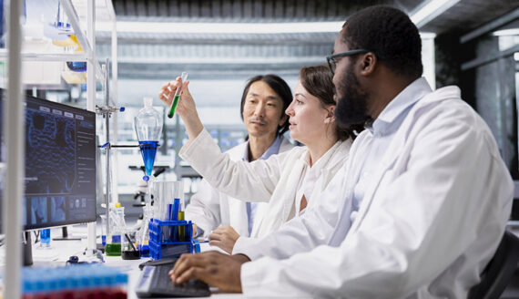 Group of lab scientists analyzing test results from their purpose built QC panel